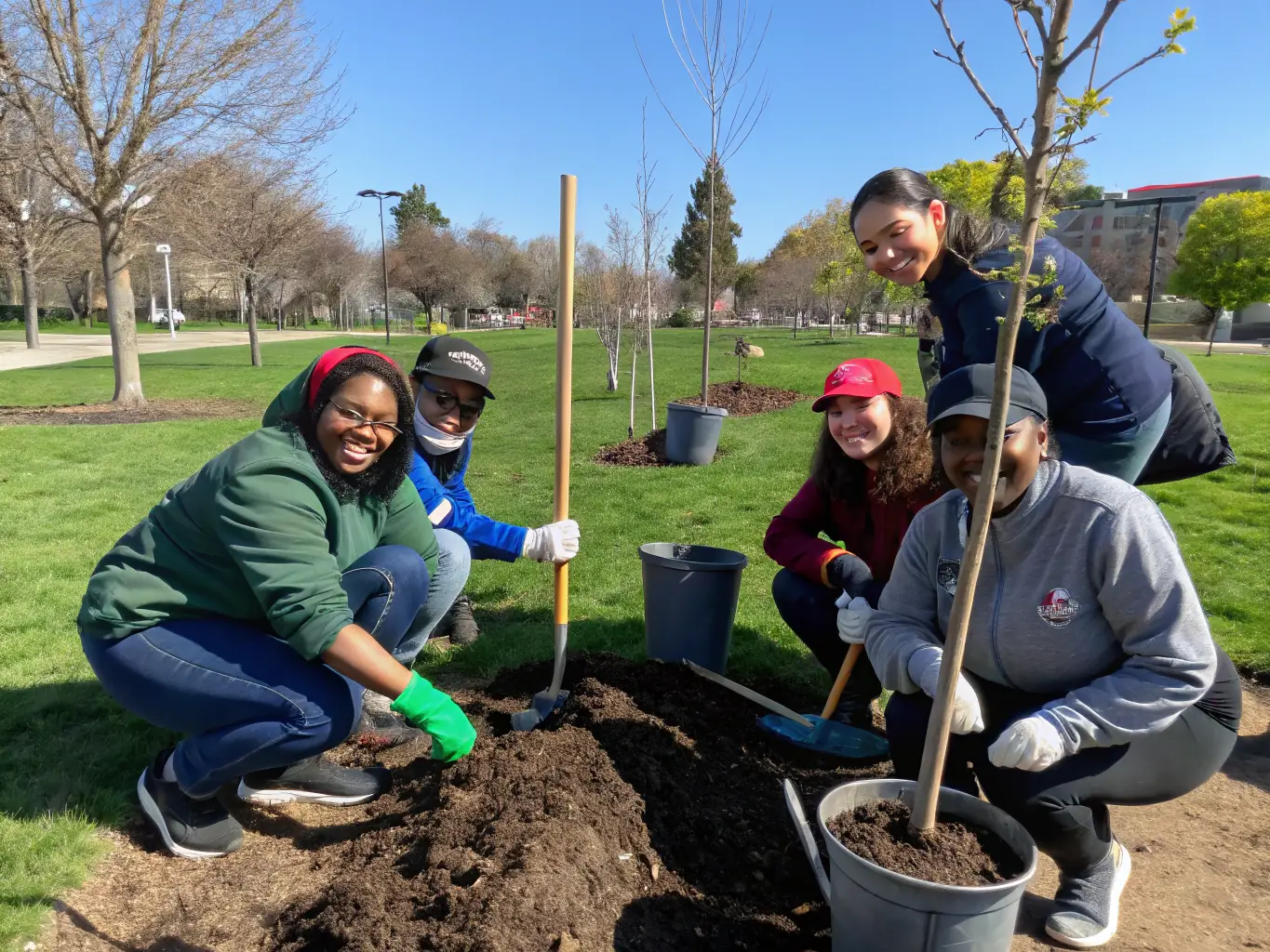 A photograph showing volunteers from Le Souvenir Français participating in a community project, such as cleaning a war memorial or planting trees in a remembrance garden.